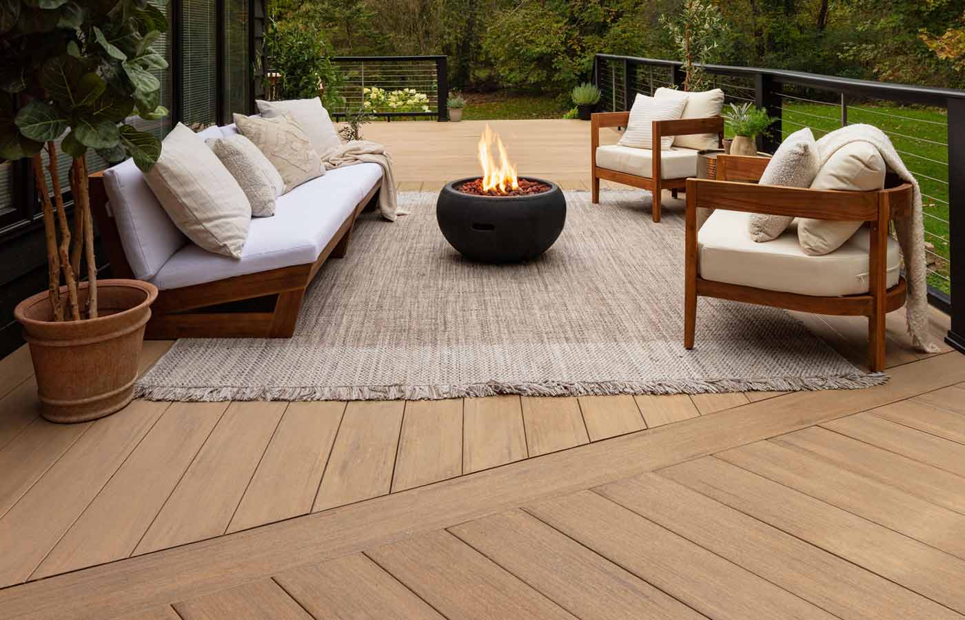 Composite deck, diagonal design, black cable railing, and fire pit, custom built by Carolina Decks in the Charlotte, NC area.
