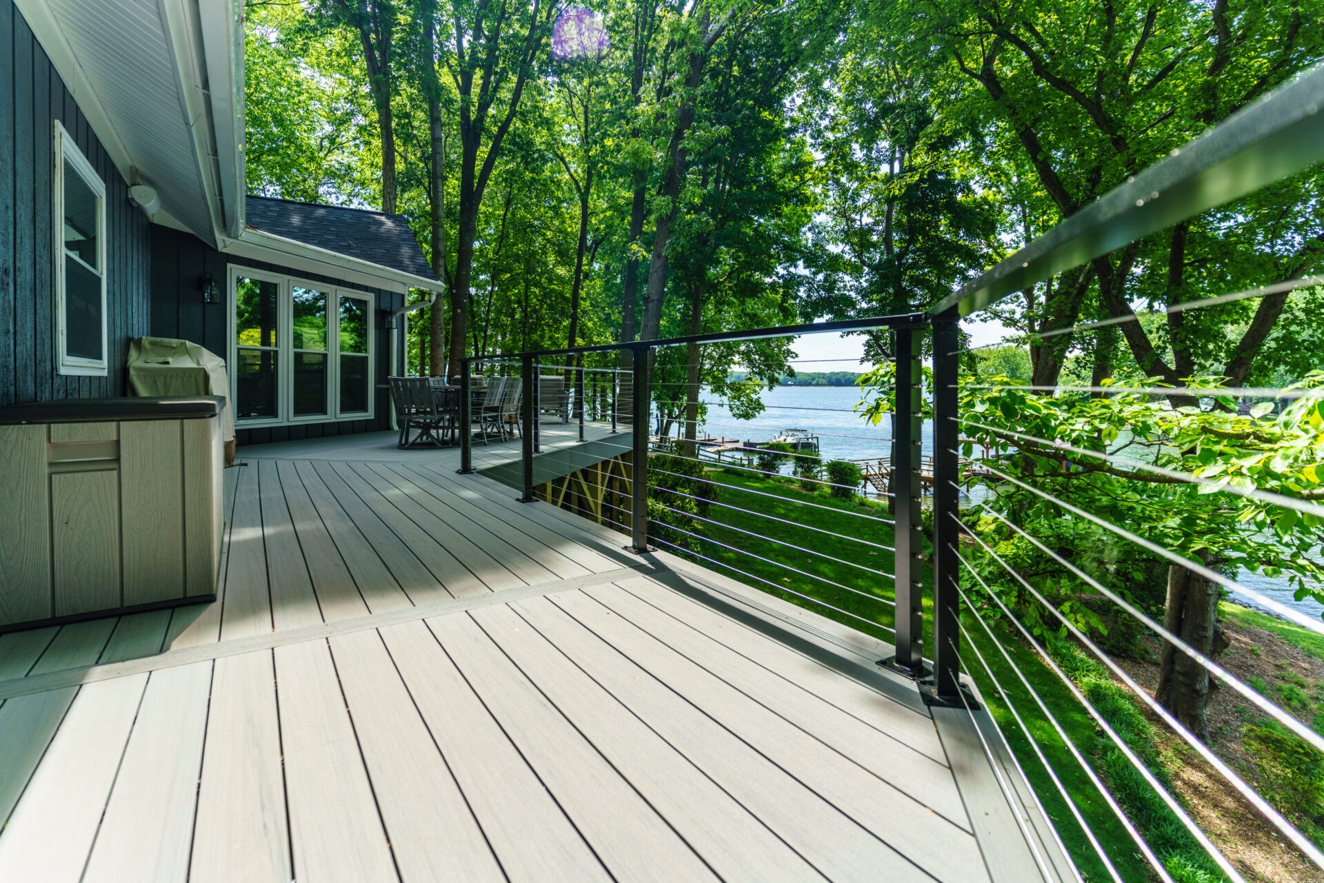 Custom lakefront composite deck construction by licensed Charlotte deck builders.