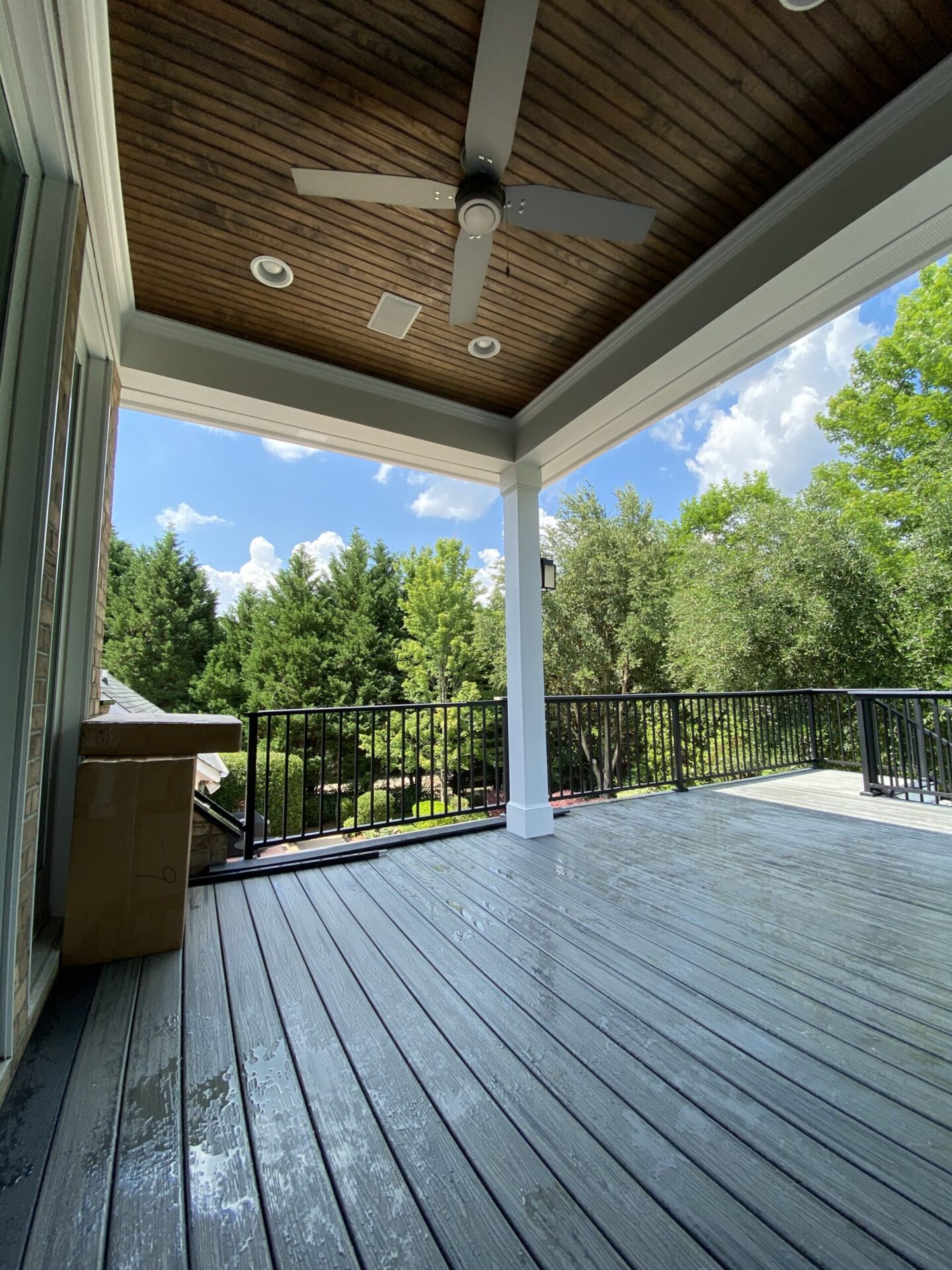 Elegant picture-frame border detail on a custom composite deck using TimberTech Advanced PVC in Dark Hickory.