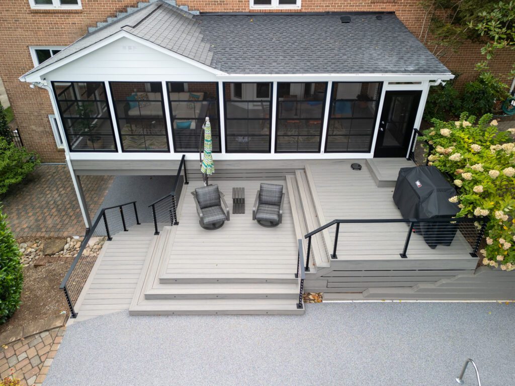 Screened porch, multi-level composite deck, cable railings to patio, custom built by Carolina Decks in the Charlotte, NC area.