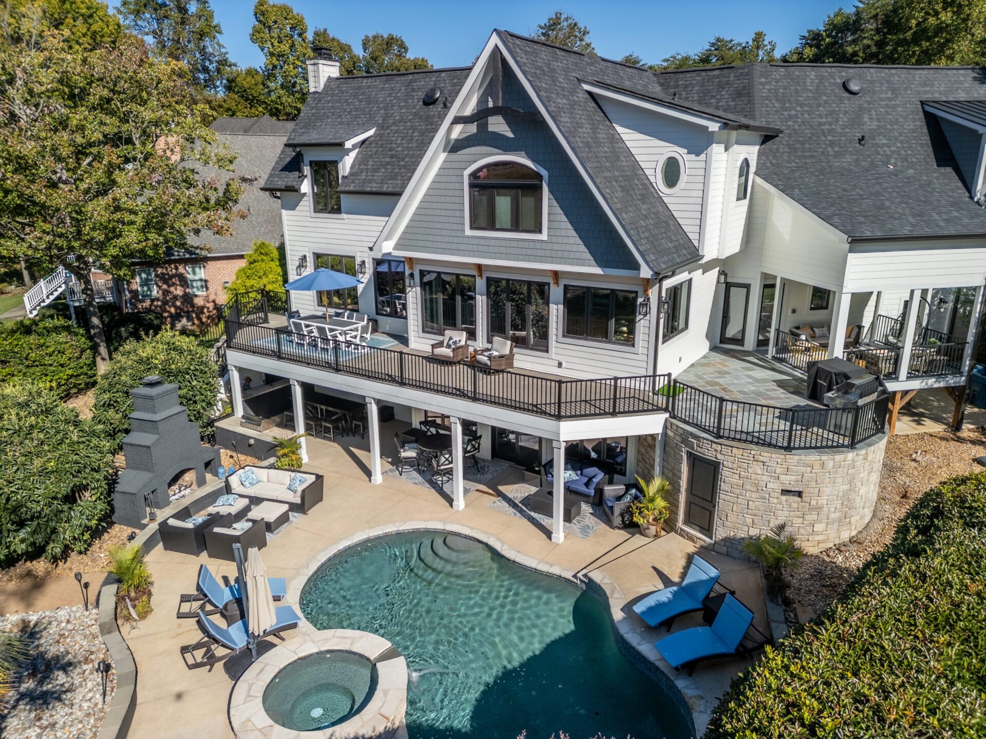 Multi-level composite deck, bluestone patio, custom pool/spa, custom built by Carolina Decks in the Charlotte, NC area.