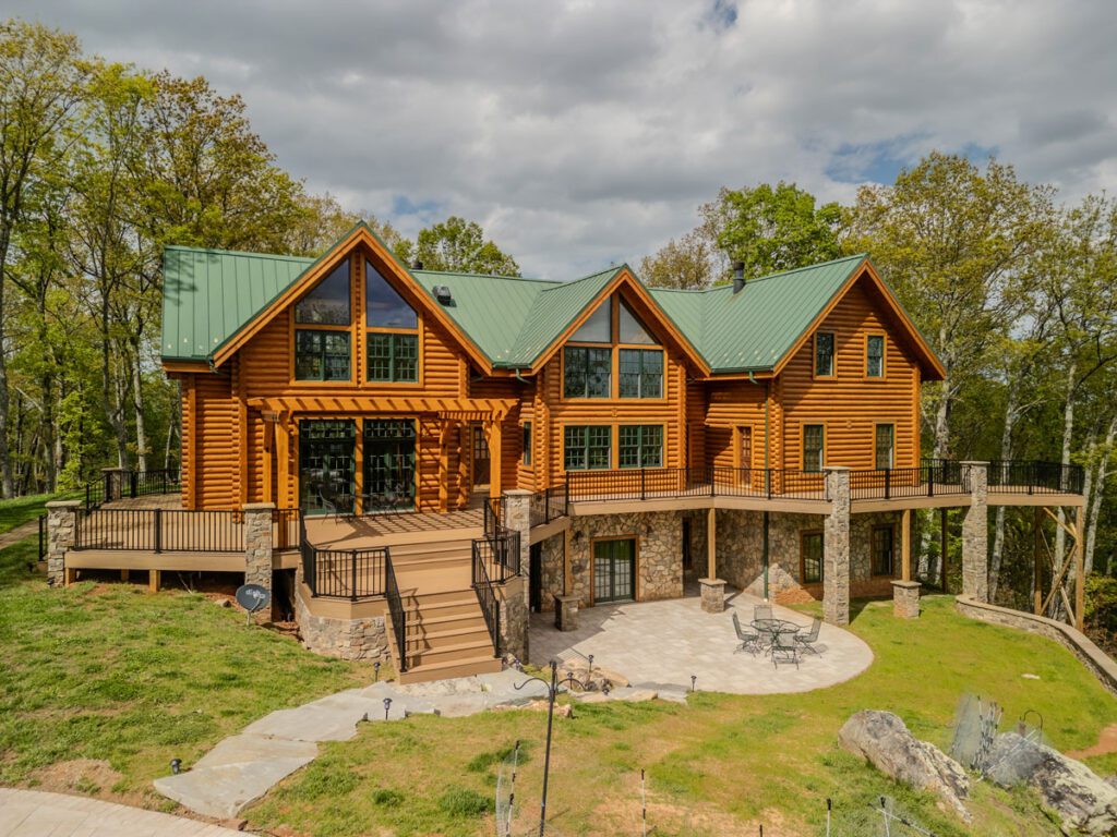 Multi-level composite deck, stone columns, and paver patio, custom built by Carolina Decks in the Lake Norman, NC area.