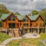 Multi-level composite deck, stone columns, and paver patio, custom built by Carolina Decks in the Lake Norman, NC area.