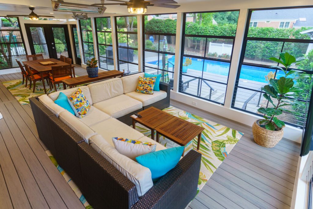 Screened porch with composite deck and large pool view windows, custom built by Carolina Decks in the South Charlotte, NC area.