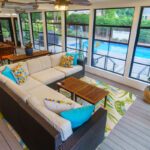 Screened porch with composite deck and large pool view windows, custom built by Carolina Decks in the South Charlotte, NC area.