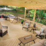 Wood covered deck features angled boards and black railings, custom built by Carolina Decks in the South Charlotte, NC area.