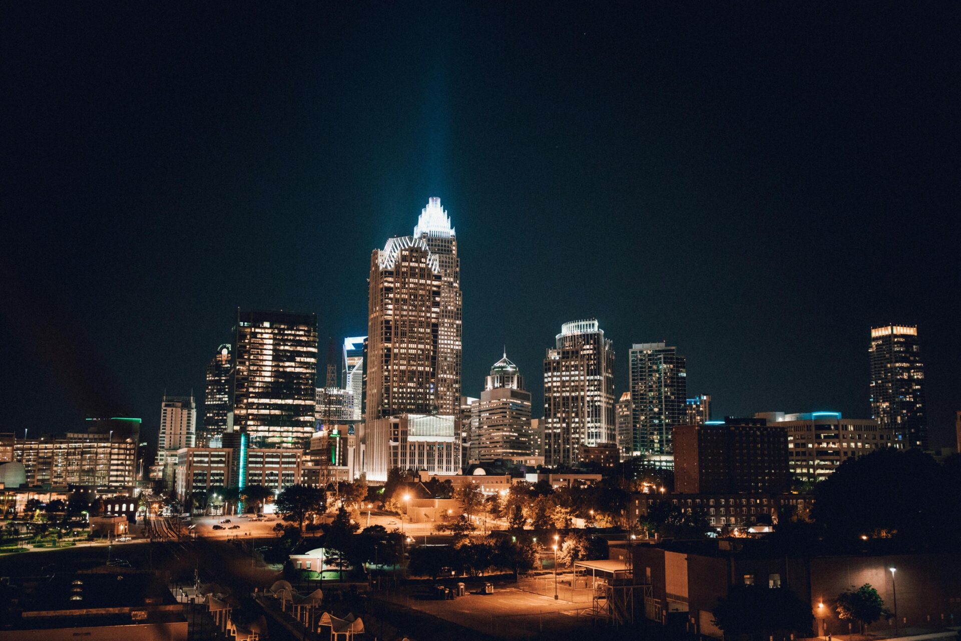 The Charlotte NC city skyline illuminated at night, inspiring custom outdoor deck lighting design.